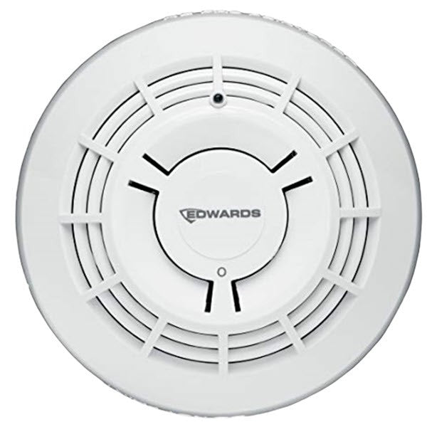 A white Edwards Signature Optica Series SIGA-OSD smoke detector with a circular design and grid-like pattern