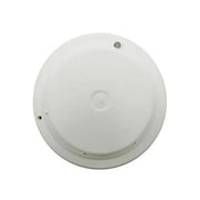 A white, circular Faraday photoelectric smoke detector with a central LED indicator and mounting screws visible from the bottom.