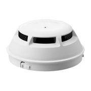A white Siemens (Pyro) OP921 Cerberus PRO Intelligent Photoelectric Smoke Detector with a triangular LED indicator on the top.