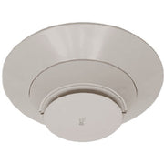 A photo of the Silent Knight IDP-HEAT-IV heat detector, displaying a white, low-profile device with a thermistor sensing circuit.